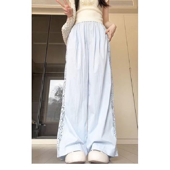 Pantaloni a gamba larga traforati con inserti in pizzo da donna estivi a vita alta con senso del design larghi sottili drappeggiati casual
