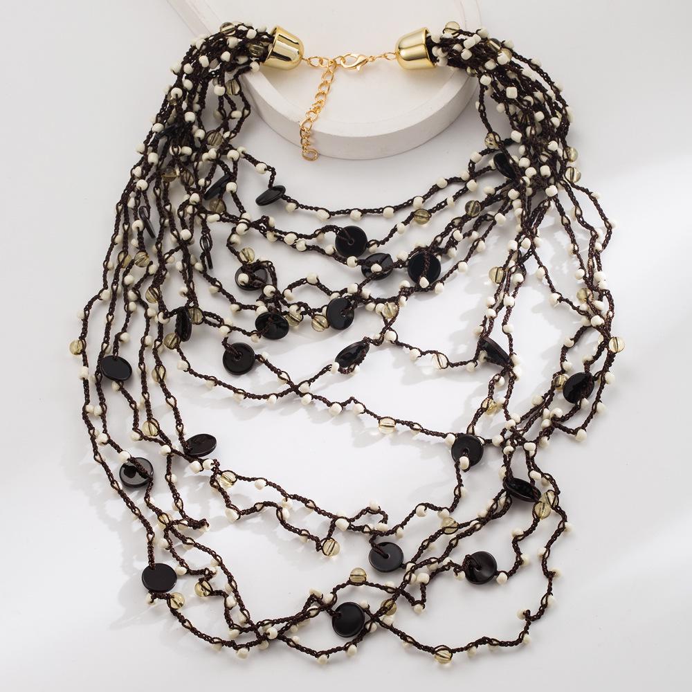 Европейское и американское ретро богемное многослойное ожерелье из бусин: Женский преувеличенный плетеный чокер ручной работы чёрный/белый