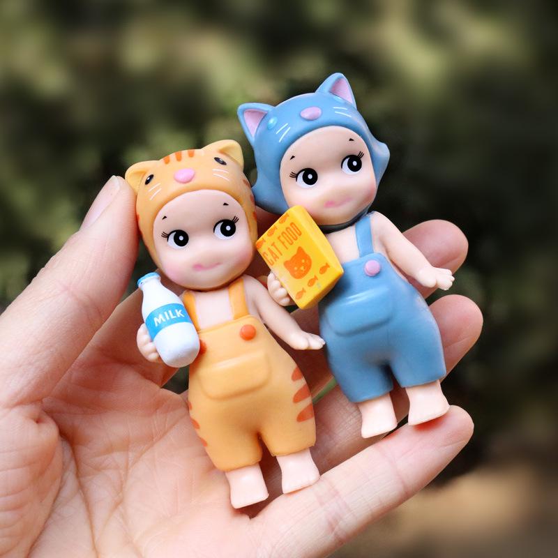 Dumb and Cute Fish-Holding Doll: Trendy Desktop or Car Ornament in Cute Dungarees