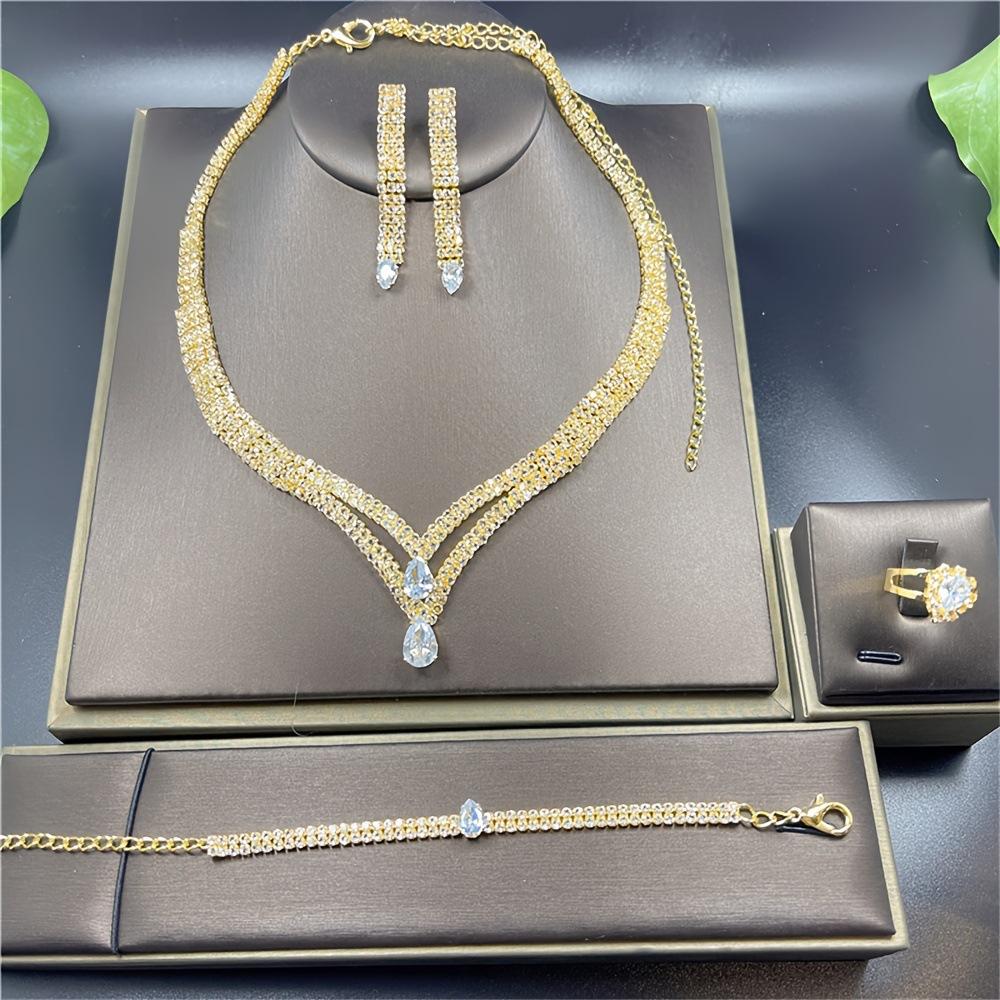 

Set New European And American Style Jewelry Bridal Wedding Ladies Four-Piece Set Exaggerated Item Jewelry Rhinestone Collarbone Chain золотий