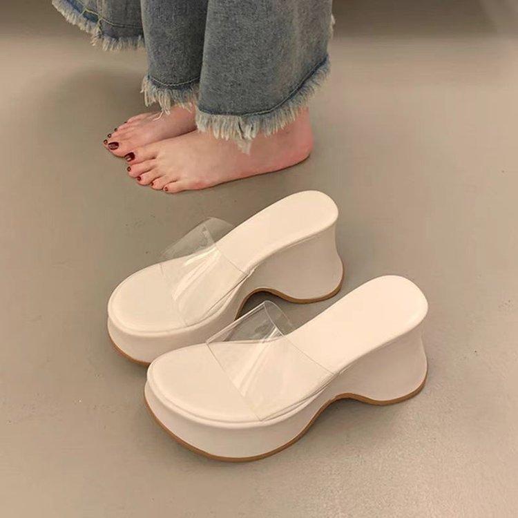 sponge cake thick bottom slope heel cool slippers women's summer wear fashion 2025 new high-end fairy wind transparent one-word drag