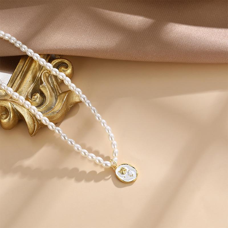 

Дизайн «Легкая роскошь» Жемчужное ожерелье Женское Высокое чувство Натуральное Простое Темперамент Роза Фритиллярия Подвеска Аксессуары