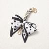 Elegant Hand-Woven Scarf Chain with Bow Decoration Pendant for Bag Strap Modification.