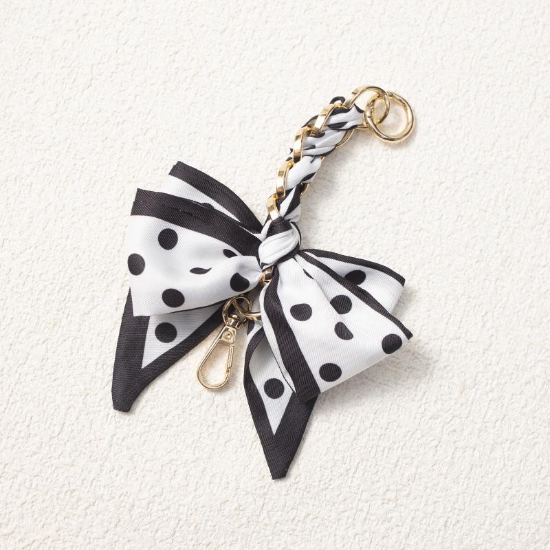 Elegant Hand-Woven Scarf Chain with Bow Decoration Pendant for Bag Strap Modification.
