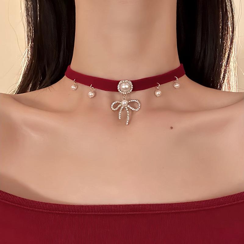 Elegant Pearl Necklace with Diamond-Studded Bow Pendant - Unique Design for Women