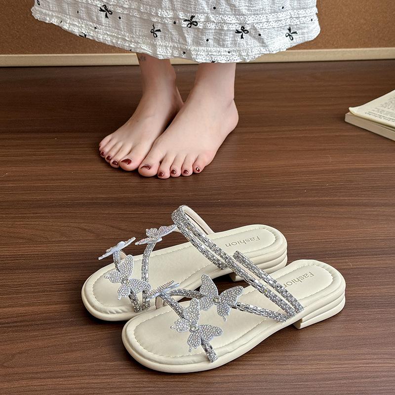 Красивые шлепанцы на плоской подошве женские летние 2025 новинка интернет-знаменитость взрыв бабочка стразы с юбкой два способа носить сандалии