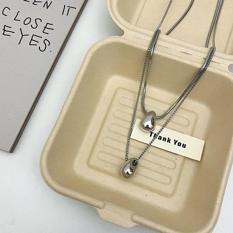 Elegante silberfarbene Tropfenform Halskette aus Titanstahl für Damen - Nicht verblassend, hochwertiges Tragegefühl, perfekt für lange Pulloverketten.