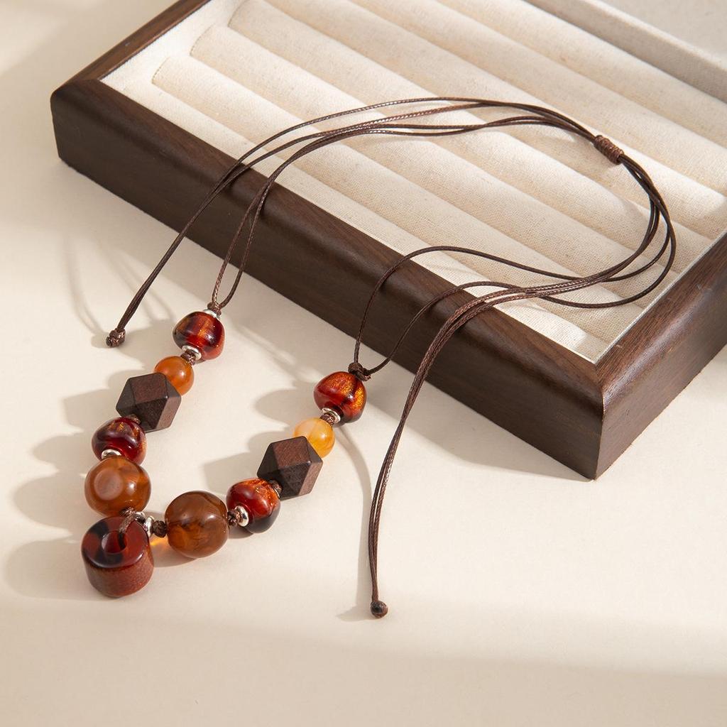 Antique Bronze Feather Necklace: Bohemian Double-Layer Zen Style for Women