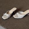 Sheepskin version~ Holiday style woven hollow sandals women's versatile bows one-word drag open-toed square head high heels summer
