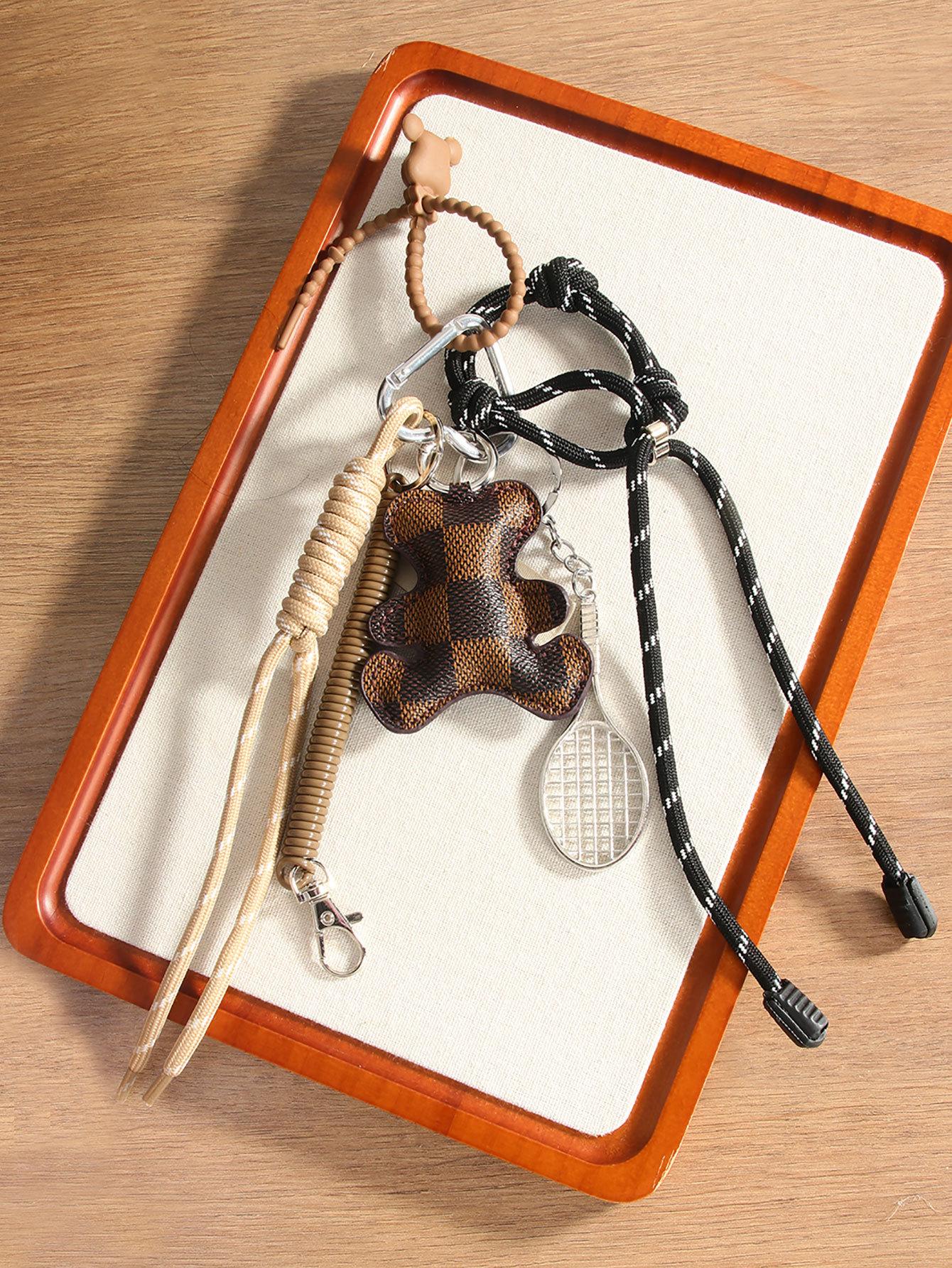 

Creative fashion leather bear alloy tennis racket handwoven rope pendant bag pendant mobile phone lanyard коричневый