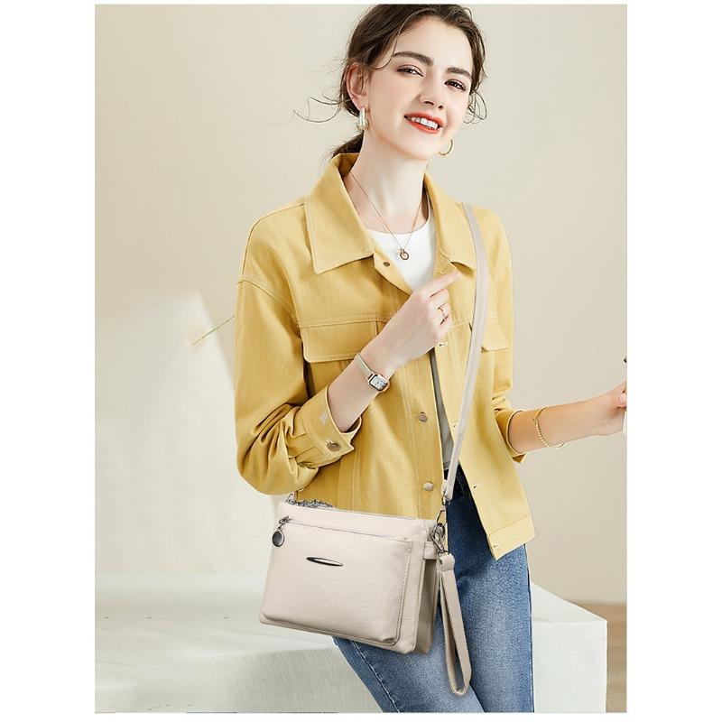 Umhängetasche mit einem Schultergurt für Mobiltelefon und Kleingeld