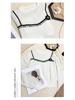 Elegant Women's Knit Top with White Lace Collar and Floral Brooch