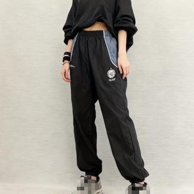 Tendance européenne et américaine simple coupe-vent rue ample pantalon couple