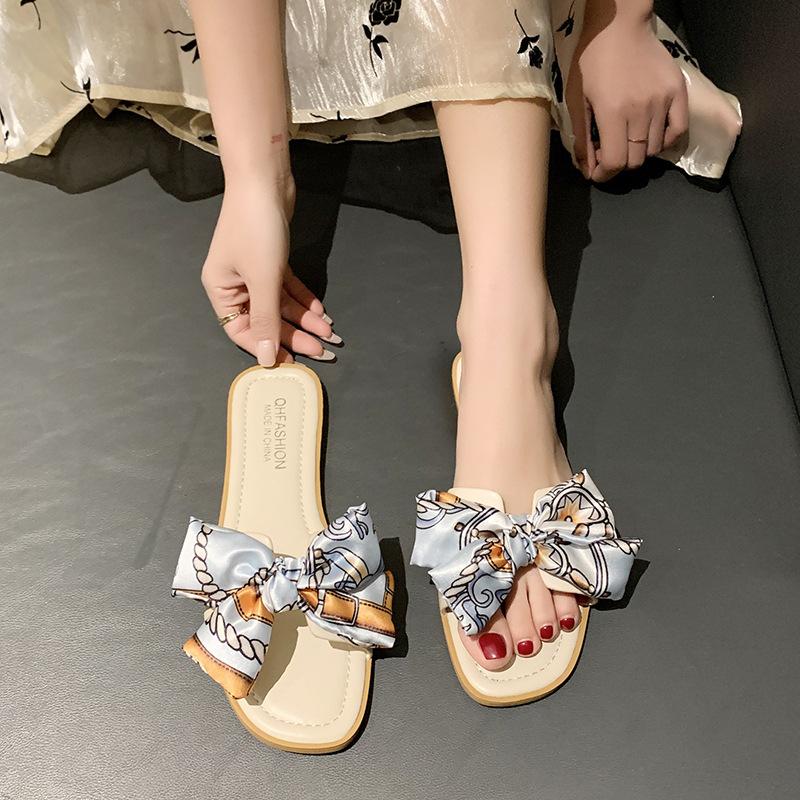 Bow slippers women's outer wear 2024 summer new flat-bottomed fashion fairy wind large size one-word cool slippers women's shoes