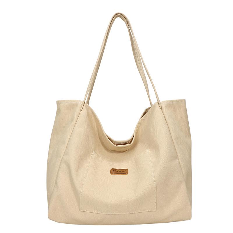 Casual large-capacity canvas bag women's bag 2025 new solid color simple tote bag fashionable shoulder armpit bag