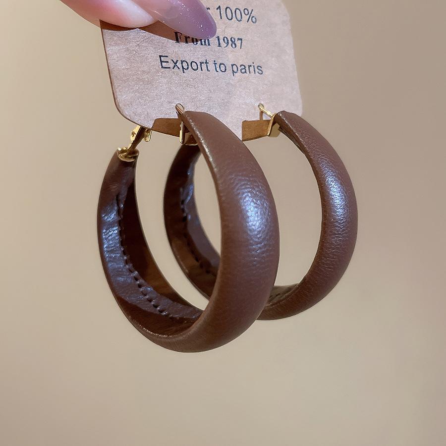 Silver needle leather geometric round pendant earrings European and American temperament earrings niche design earrings women