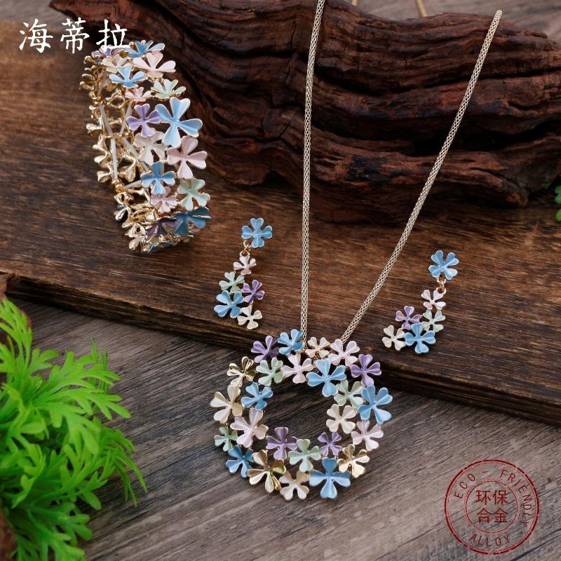 New enamel color hollow flower stud earrings pendant bracelet set women's autumn and winter high-end flower necklace