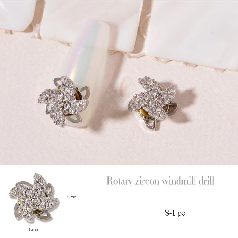 

Золото Срібло Обертається Pinwheel нігтів мистецтво ювелірні вироби 3d вітряк Циркон нігтів алмази прикраси спина манікюр прикраси S-1 pc срібний