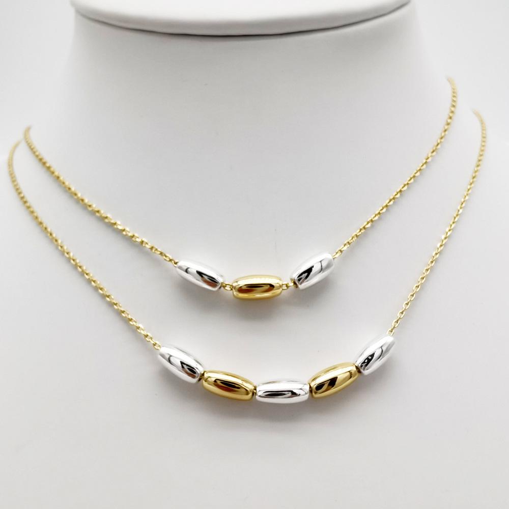 

Женское золотое геометрическое колье-подвеска с кисточкой и белыми бусинами