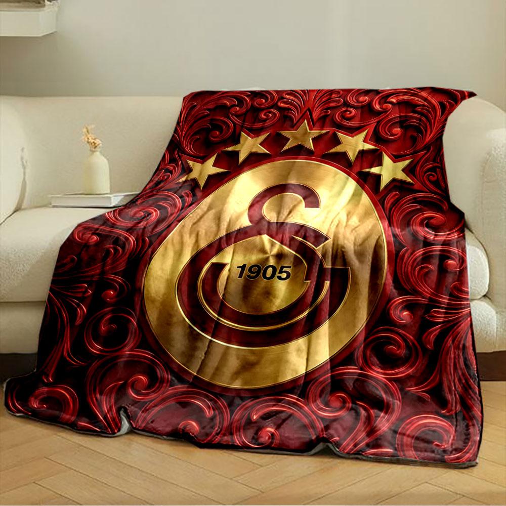 Golden emblem with "1905" and stars, surrounded by red floral patterns. for all seasons blanket lunch break throw gift
