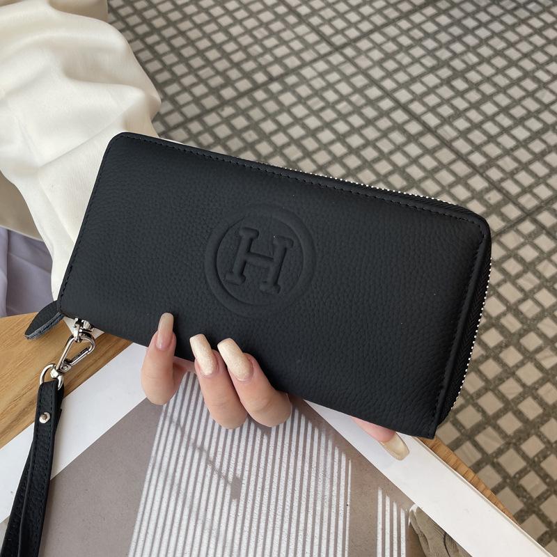 

Женский кошелек из натуральной кожи 2025: Большая вместимость, несколько слотов для карт, клатч-браслет на молнии, держатель для телефона.