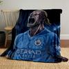The pattern depicts a fierce animated figure in a blue soccer jersey. for all seasons blanket lunch break throw gift