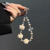 New high-end autumn and winter pom-pom mobile phone chain beaded short lanyard bag keychain pendant girl pendant