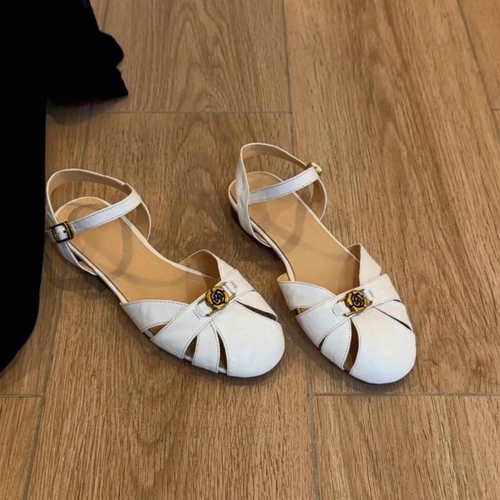 Sheepskin version camellia hollow breathable Roman shoes women's summer wear leather bag head shoes retro word with sandals