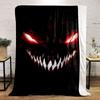 Sinister, glowing red eyes and sharp white teeth in a dark background. for all seasons blanket lunch break throw gift