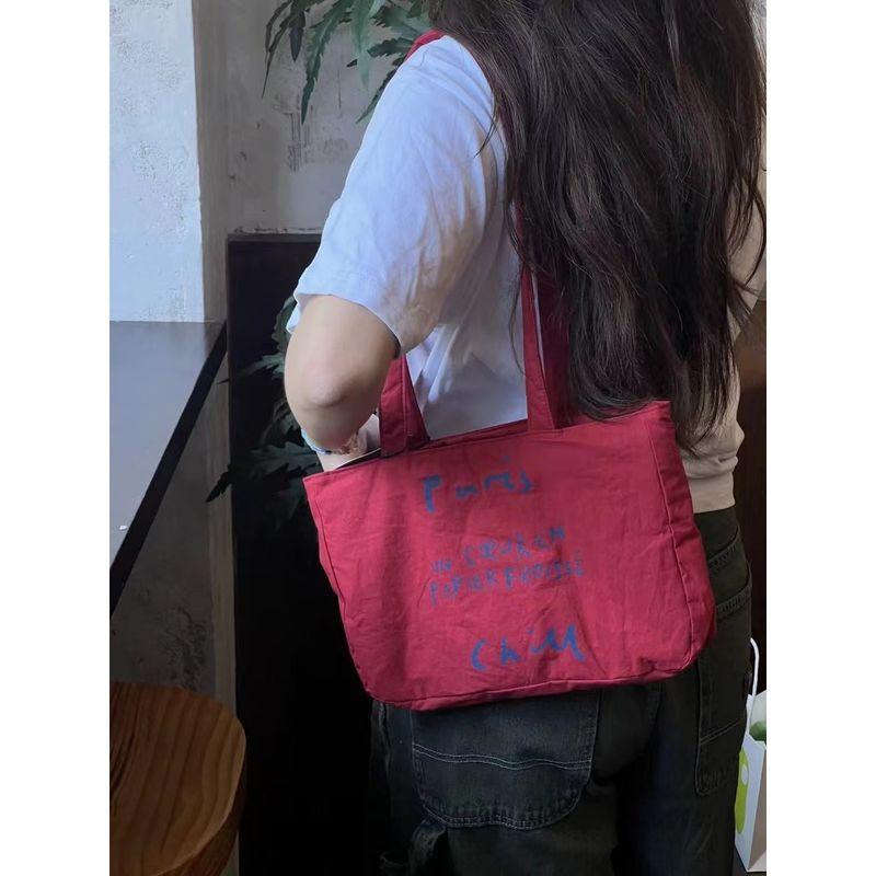 

Simple Casual Letter Canvas Bag Women 2025 Korean Series Niche Design Red Bag Commuter Versatile Underarm Bag Red