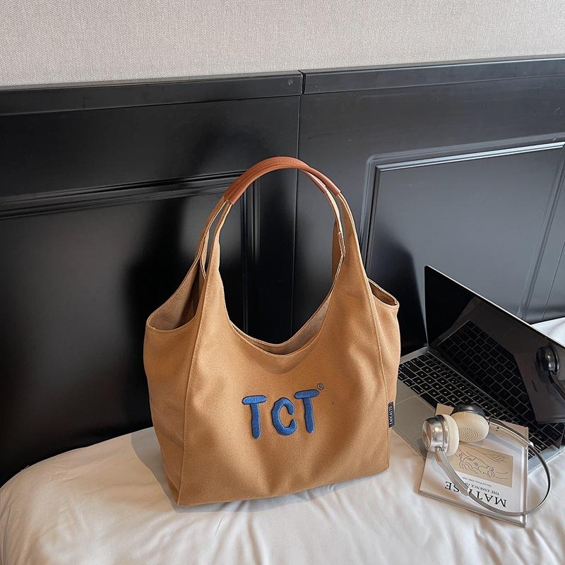 

2025 summer new high-value girls tote bag solid color embroidery commuter temperament fashionable underarm bag