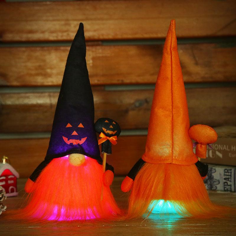Luminous Ghost Face Halloween Doll Figurine with Rudolph Pendant for Window Display.