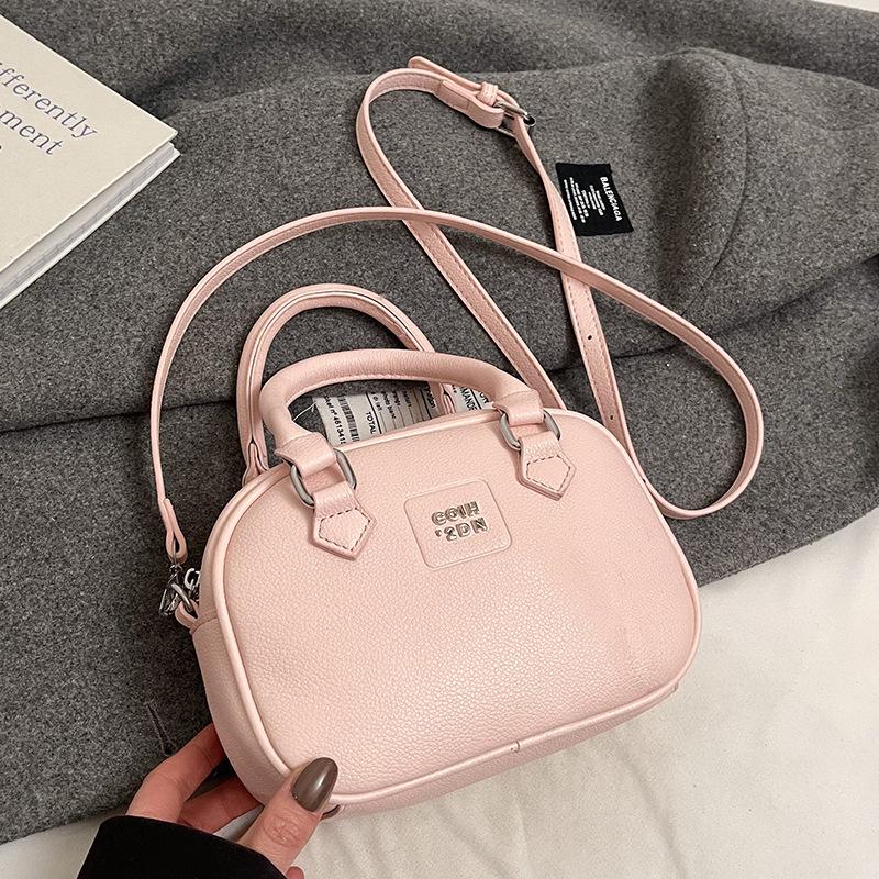 Early Spring Hot Sale French Niche Fashionable Portable Bowling Bag Solid Color Versatile Temperament Advanced Sense Messenger Women's Bag