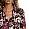 A lady's elegant floral-patterned blouse, suitable for daily wear, as well as for dates and vacations.