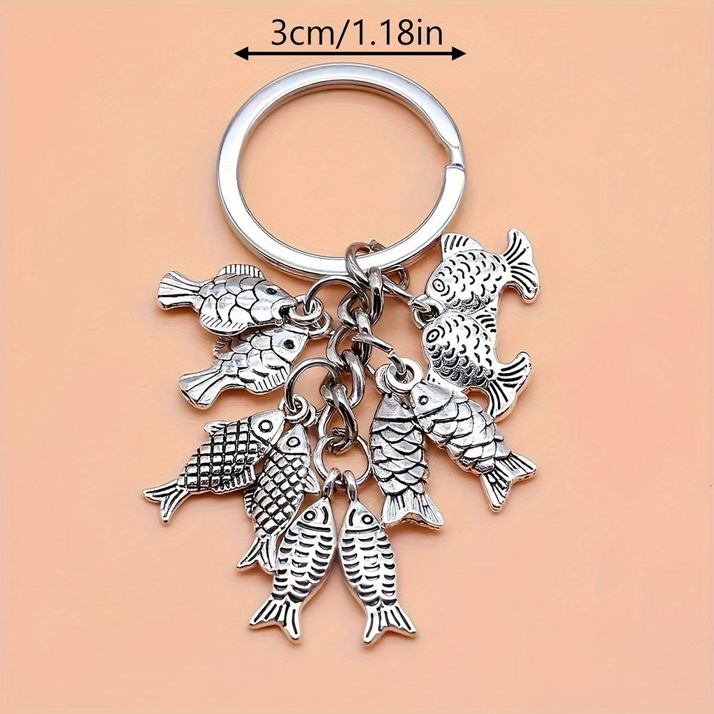 Fashionable goldfish pendant keychain, simple and elegant souvenir gift for travelers, perfect for fishing enthusiasm.