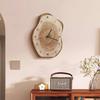 Clock with an irregular wood grain pattern; silent operation. Suitable as living room decor or as a tabletop clock (battery included).