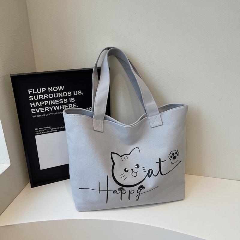 2025 Herbst neue Canvas-Tasche tragbar Schulter große Kapazität Cartoon niedlich Mode einfach Nische Tragetasche
