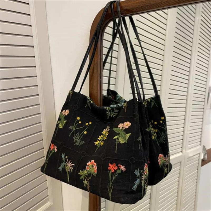 Large capacity embroidered tote bag women's 2026 spring and summer new niche canvas embroidered shoulder bag commuter bucket bag