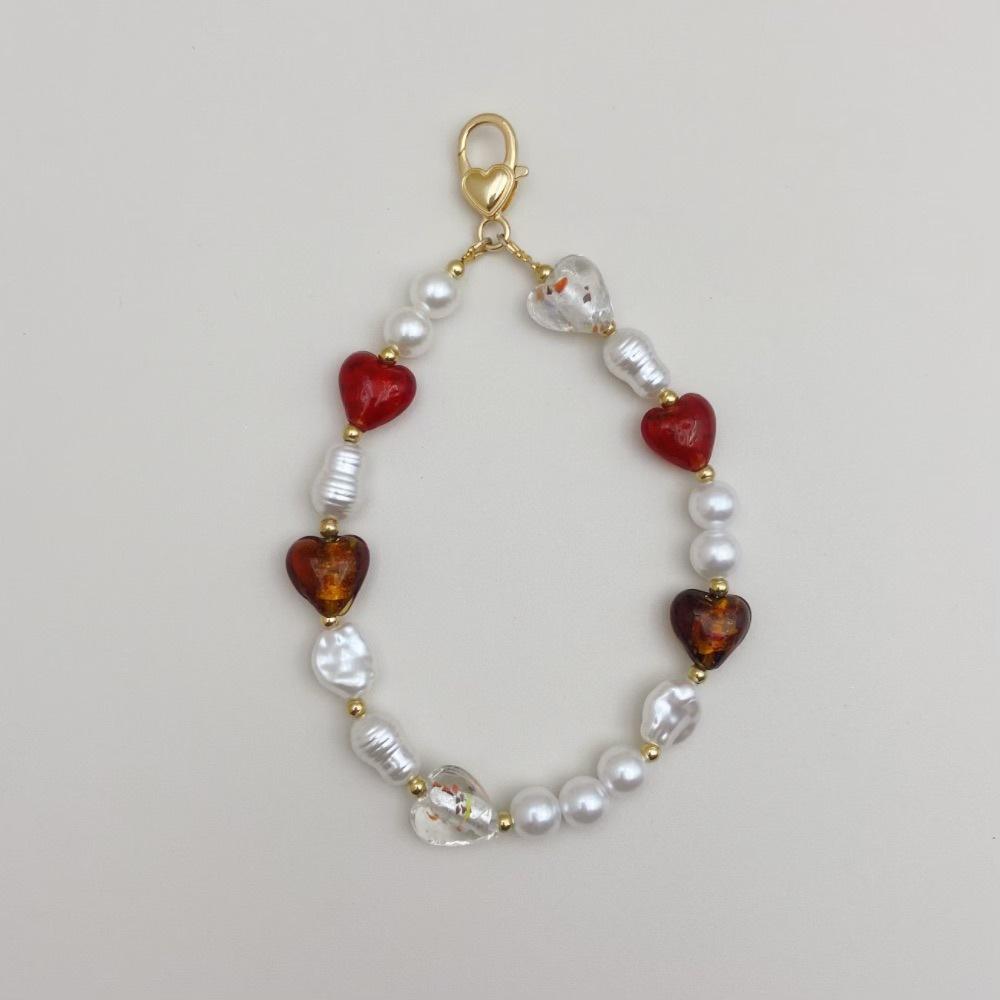 

The same INS special-shaped pearl glass love fashion anti-lost hand carry pendant short mobile phone chain