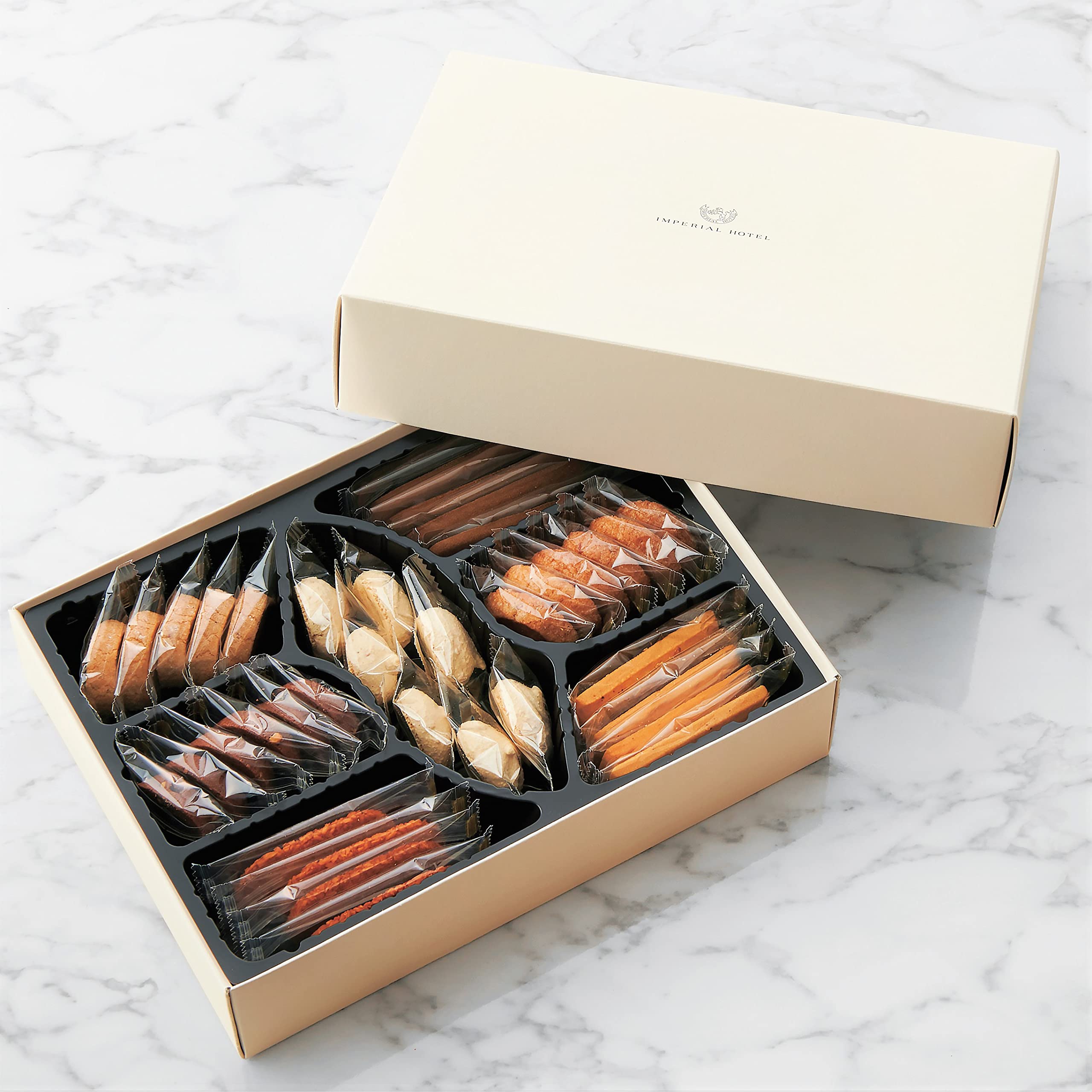 

carrying Imperial Hotel Cookie Assortment in a protective white box [With bag] (C-23N) Delivered