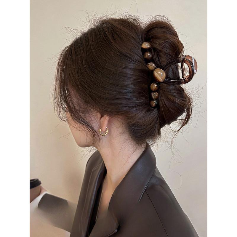 A Gradient Round Bead Shark Clip A Large Hair Clip and A Hairpin for The Back of A Woman's Head