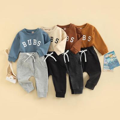 2-delige babypakjesset, jongens met letterprint, ronde hals, lange mouwen en lange broek met striksluiting, 0-3 jaar
