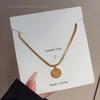 18K Gold Round Tag Titanium Steel Necklace - Light Luxury Niche Blade Chain Choker for Women's Cold Style.