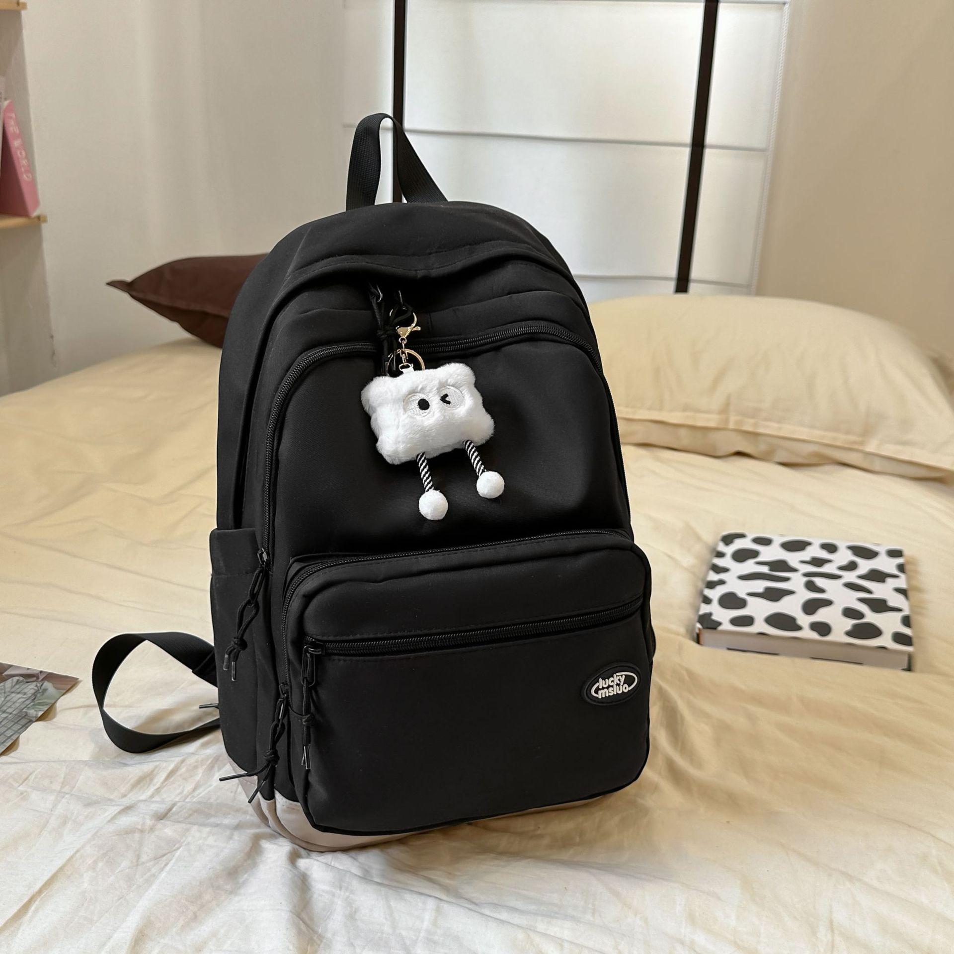 

Large capacity schoolbag student backpack junior high school high school students simple college students new backpack versatile solid color