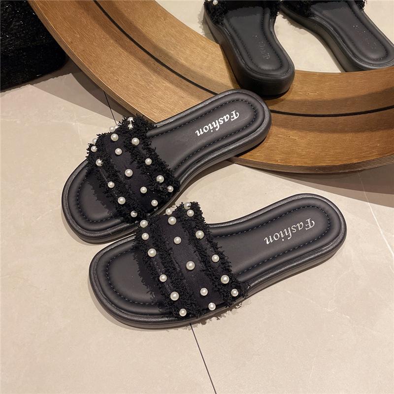 

Going out slippers women s summer wear 2025 new fashion flat-bottomed fairy wind one-word drag beach ins tide 40 чёрный