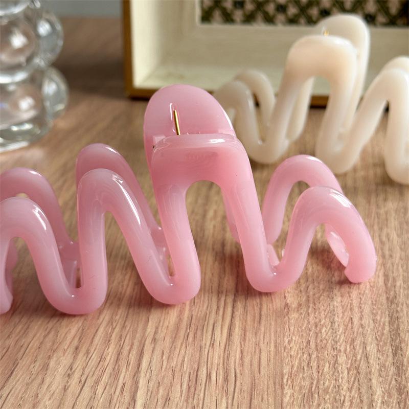 Fluid Wave Silhouette Hair Clip In Dreamy Translucent Hues Provides Secure Hold For Messy Buns And Modern Minimalist Updos