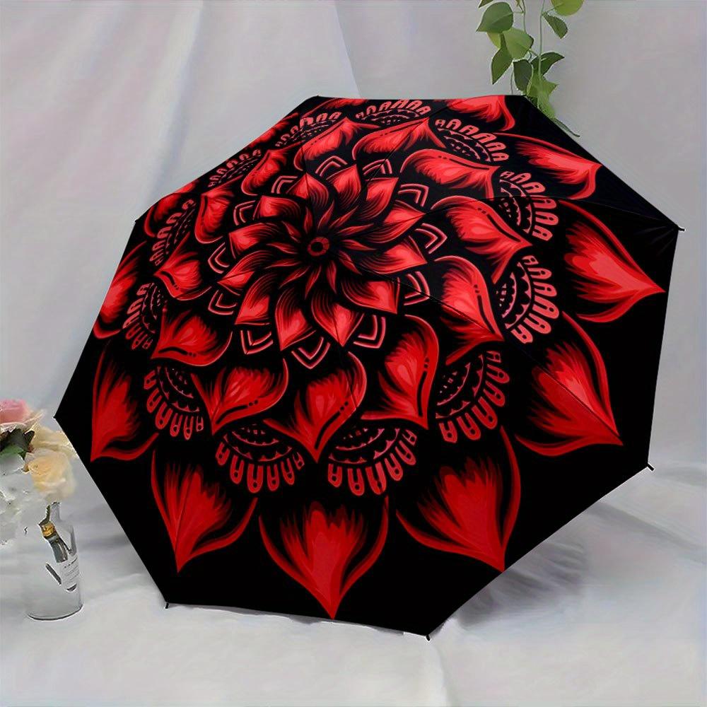 This Compact Umbrella Showcases a Lively Red Mandala Pattern with Petal Motifs Extending Outward from The Middle. Ideal for Tr