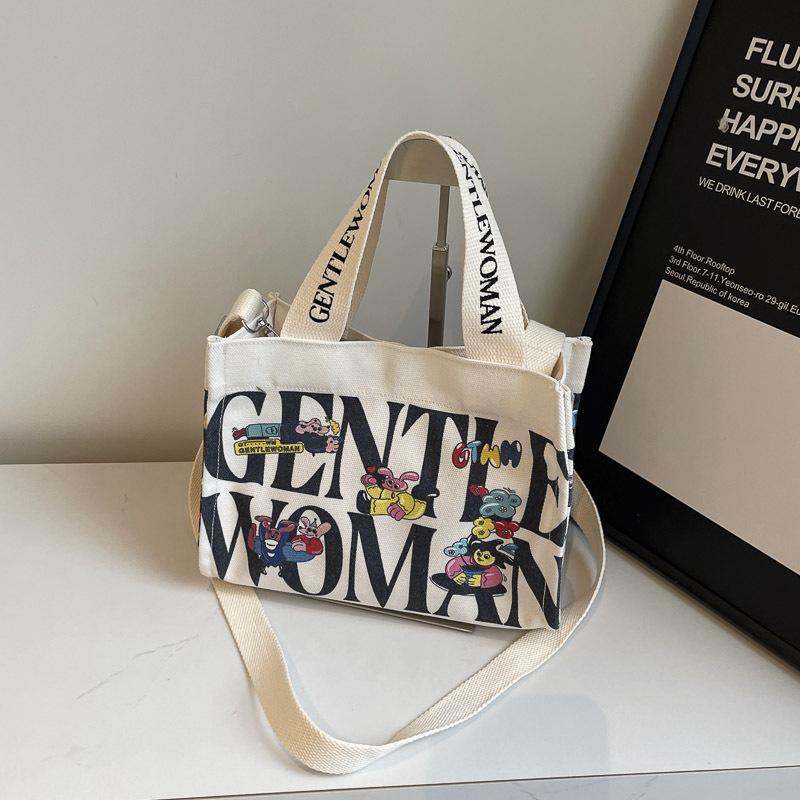 Fashion letter canvas small bag women 2025 new casual fashion messenger mobile phone bag going out tote bag simple