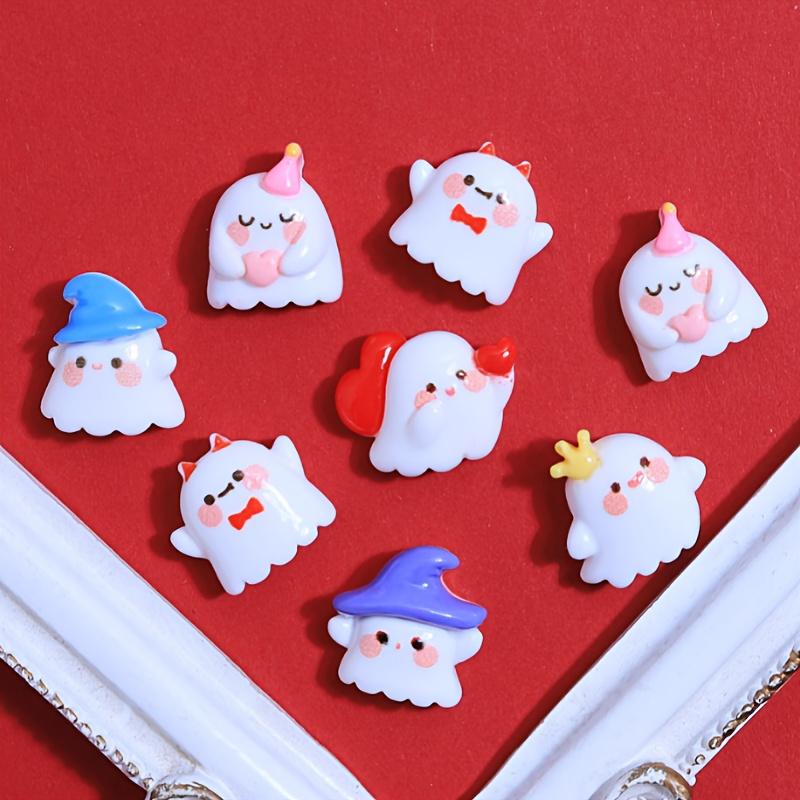 A pack of 12 adorable Halloween ghost resin accessories for DIY hair clips and decorations, including shoe buckles, hat patches,