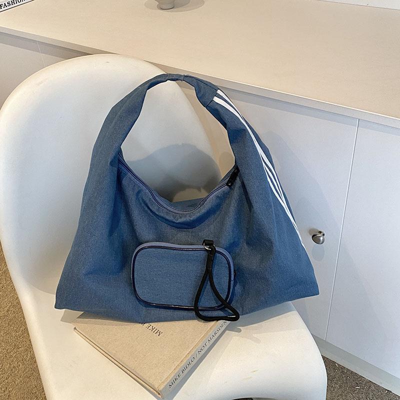 

Korean version of trendy fashion tote bag women s 2024 summer simple casual shoulder bag beautiful niche design women s bag синій